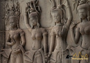 Devatas holding hands in Angkor Wat temple