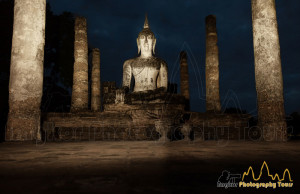 Seated Buddha at Wat Mahathat temple at night