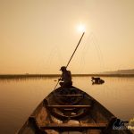 fisherman on boat siem reap photography tours