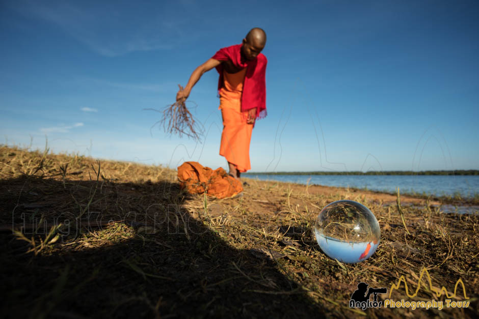 glass ball photography cambodia monk