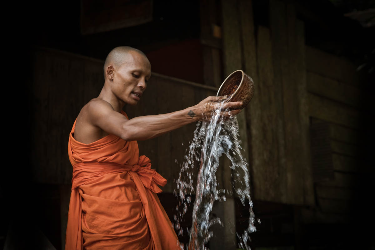 monk water blessing cambodia