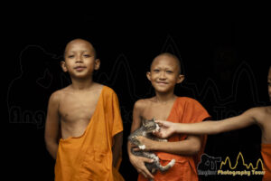 cambodian novice monks with cat