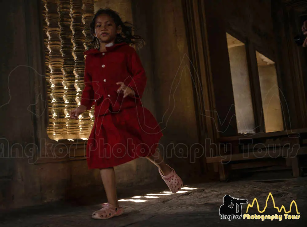 Kid running in Angkor Wat